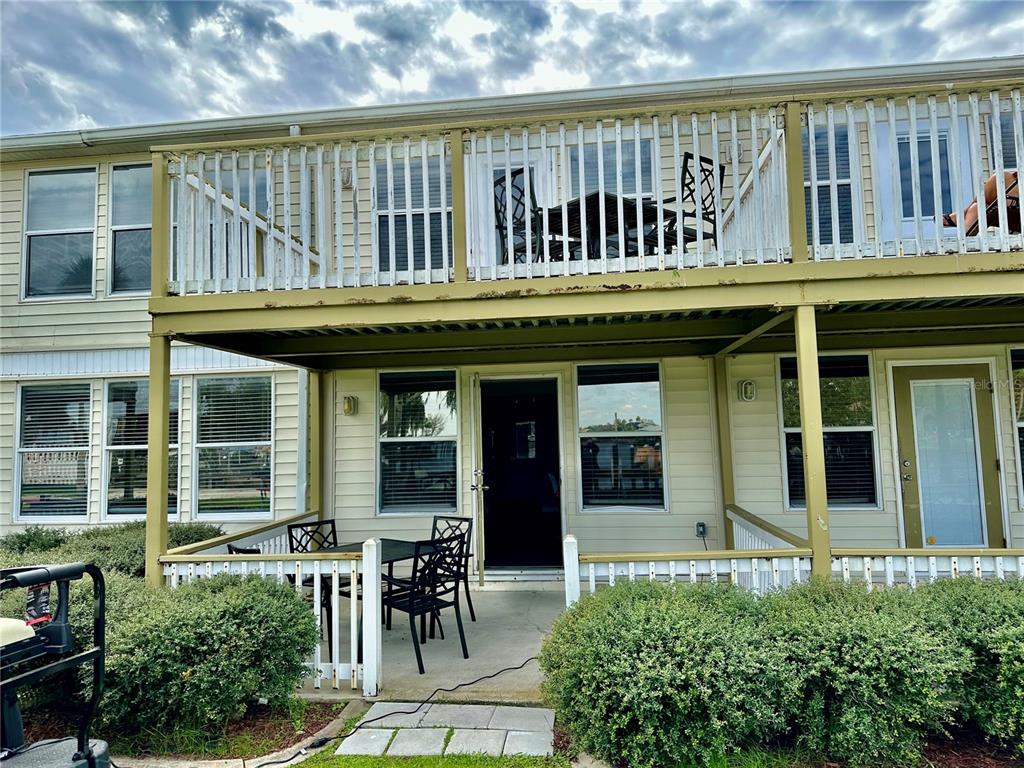 5297 South Cherokee Way, Unit 104 Homosassa, FL 34448 - Photo 1 of 27 a view of a cafe with a table and chairs