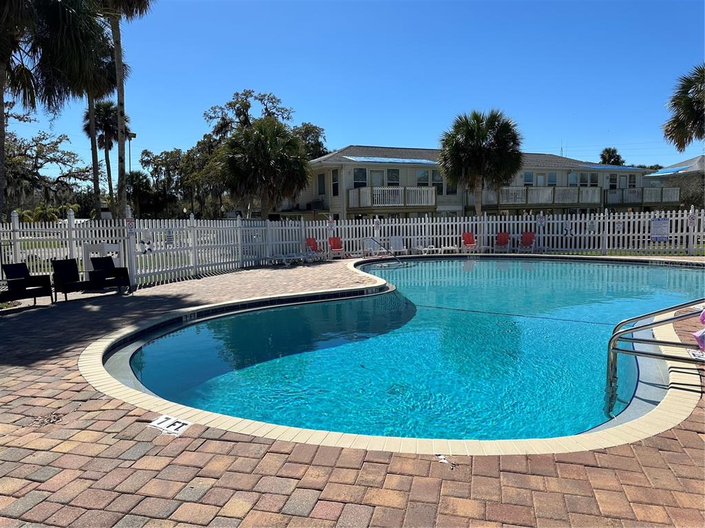 5297 South Cherokee Way, Unit 104 Homosassa, FL 34448 - Photo 17 of 27 a view of swimming pool having outdoor seating