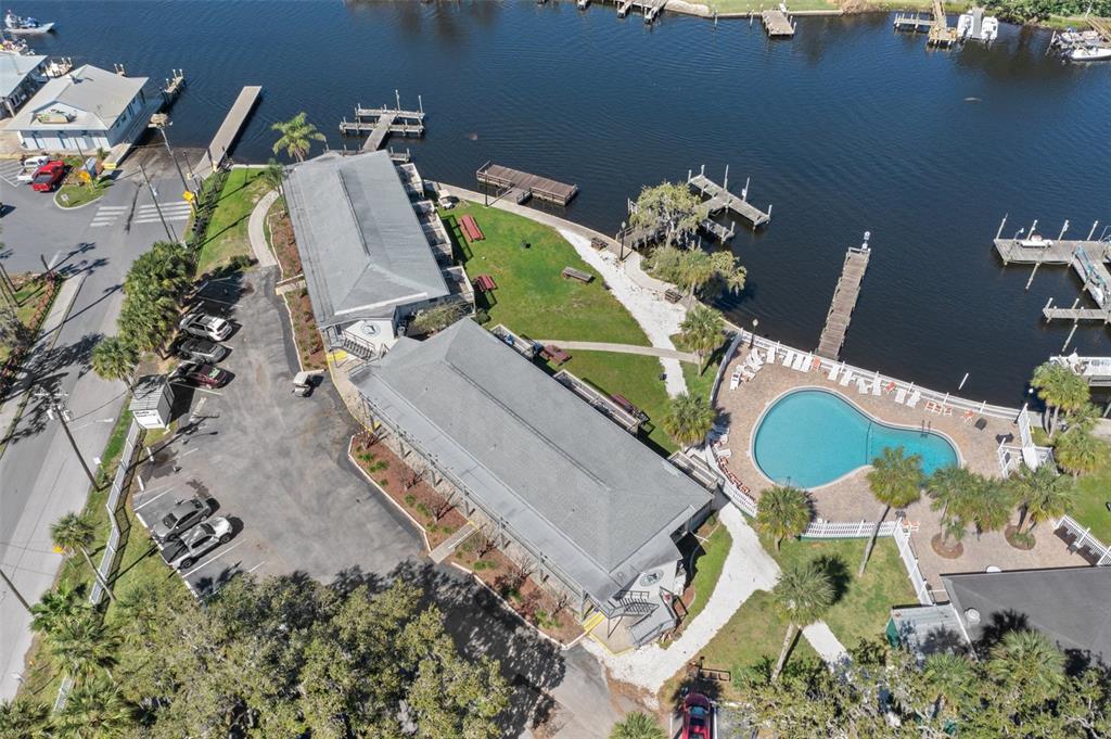 5297 South Cherokee Way, Unit 104 Homosassa, FL 34448 - Photo 27 of 27 an aerial view of a house with a swimming pool and outdoor seating