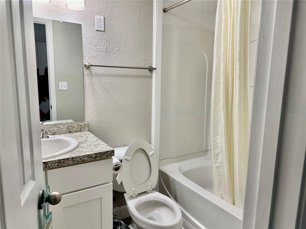 5297 South Cherokee Way, Unit 104 Homosassa, FL 34448 - Photo 10 of 27 a bathroom with a sink toilet and shower