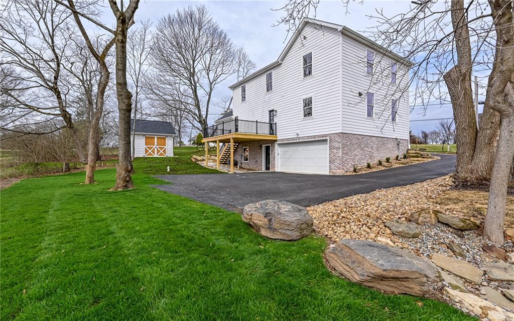 1773 Locust Road Sewickley, PA 15143 - Photo 26 of 34 Long driveway with two car garage. Professionally landscaped. Grass seed was just planted. (Grass has been photo shopped into photo)