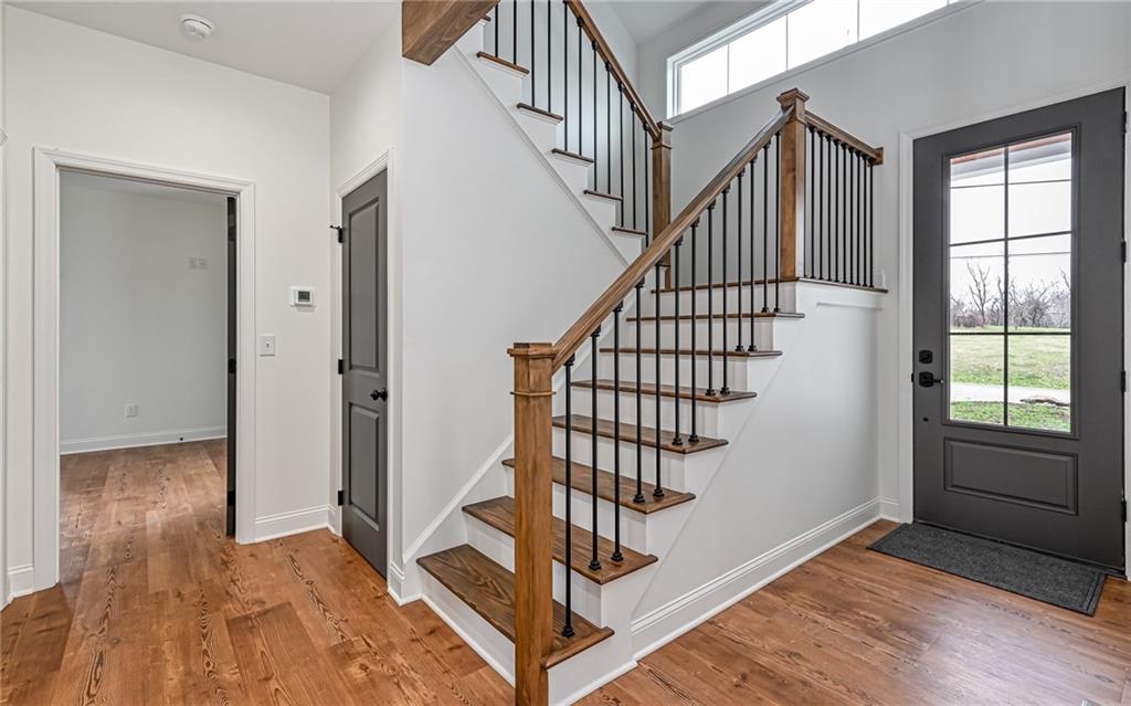 1773 Locust Road Sewickley, PA 15143 - Photo 3 of 34 Two story entrance with 8 foot front door and custom wood floored & wood banister to second level.