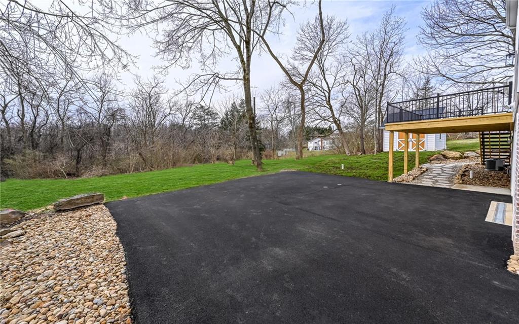 1773 Locust Road Sewickley, PA 15143 - Photo 31 of 34 Asphalt driveway. The wooded area is the 2nd lot that is .50 acre.