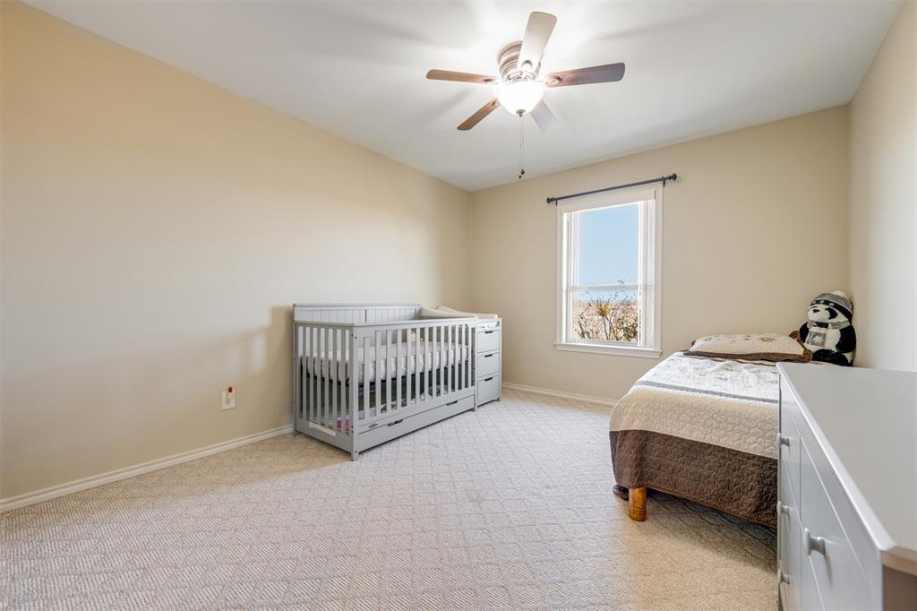 3418 Fm 38 Street North Brookston, TX 75421 - Photo 11 of 22 a bedroom with a bed and a chandelier