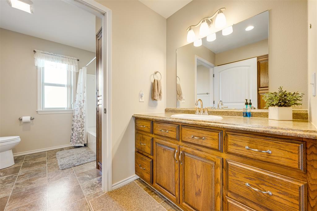 3418 Fm 38 Street North Brookston, TX 75421 - Photo 13 of 22 a bathroom with a double vanity sink and a mirror