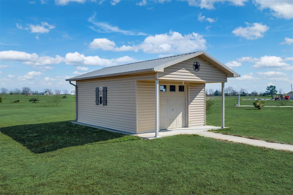 3418 Fm 38 Street North Brookston, TX 75421 - Photo 19 of 22 a front view of a house with garden