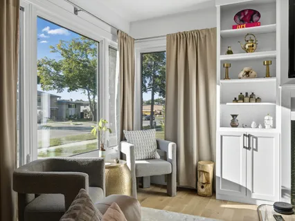 a living room with furniture and a window