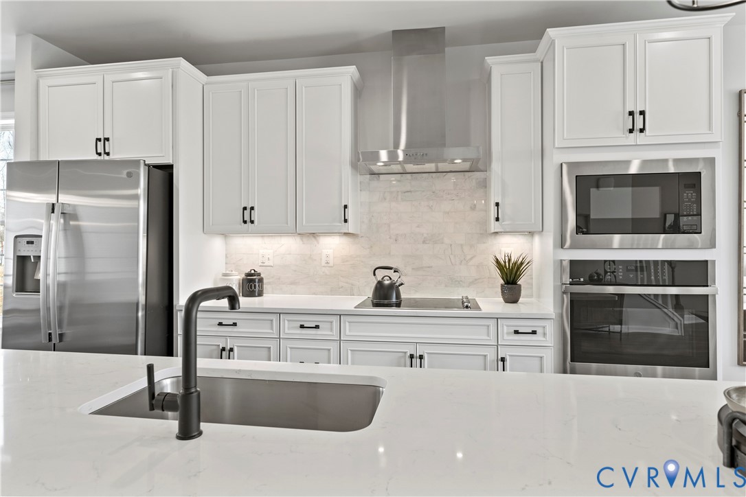 13133 Brattice Loop Midlothian, VA 23114 - Photo 11 of 40 a kitchen with granite countertop a stove and a refrigerator