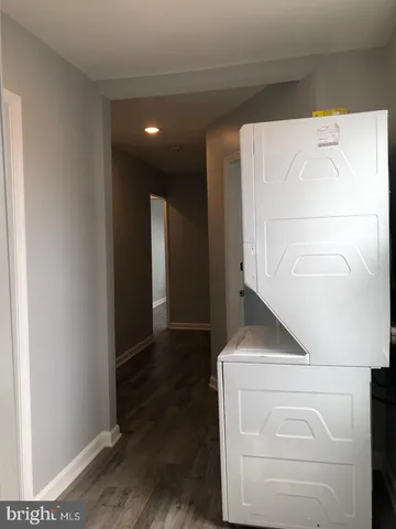 a view of hallway with wooden floor