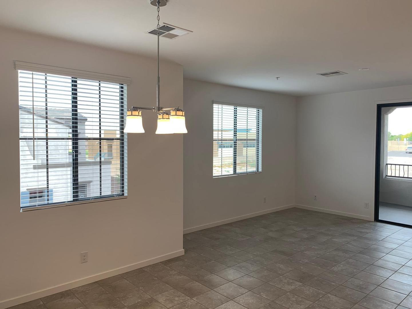 3900 East Baseline Road, Unit 118 Phoenix, AZ 85042 - Photo 16 of 32 an empty room with windows and closet