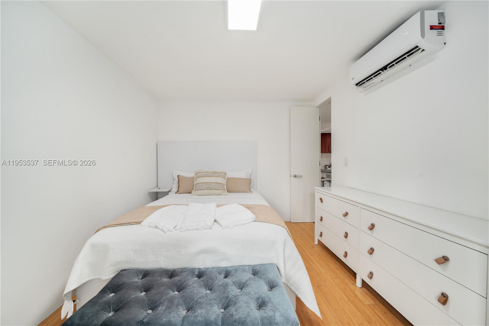 651 Northeast 60th Street, Unit 25 Miami, FL 33137 - Photo 15 of 23 a bedroom with a bed and a window