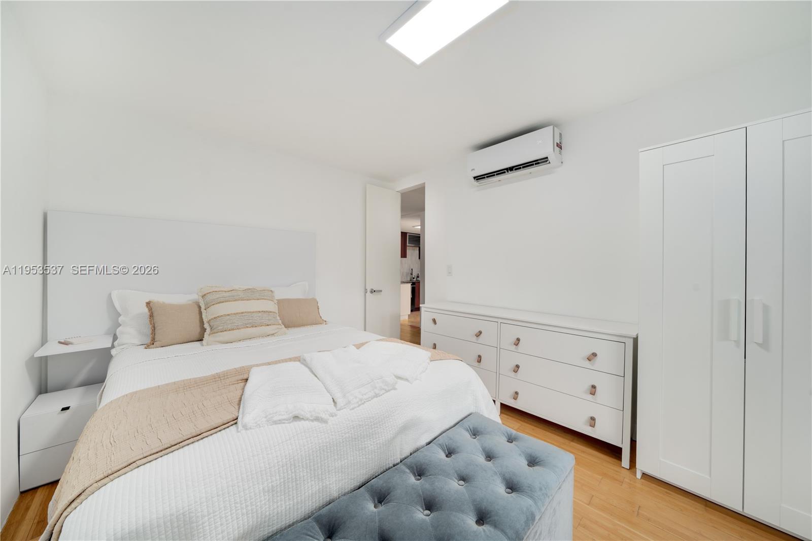 651 Northeast 60th Street, Unit 25 Miami, FL 33137 - Photo 16 of 23 a large white bed in a white room