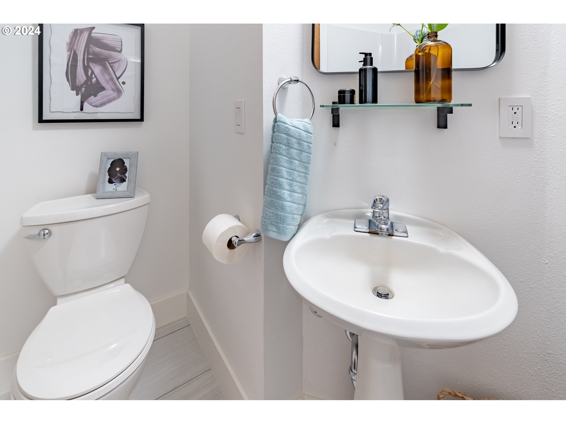 8015 Southwest Mapleleaf Street Portland, OR 97223 - Photo 25 of 35 a bathroom with a toilet sink and mirror