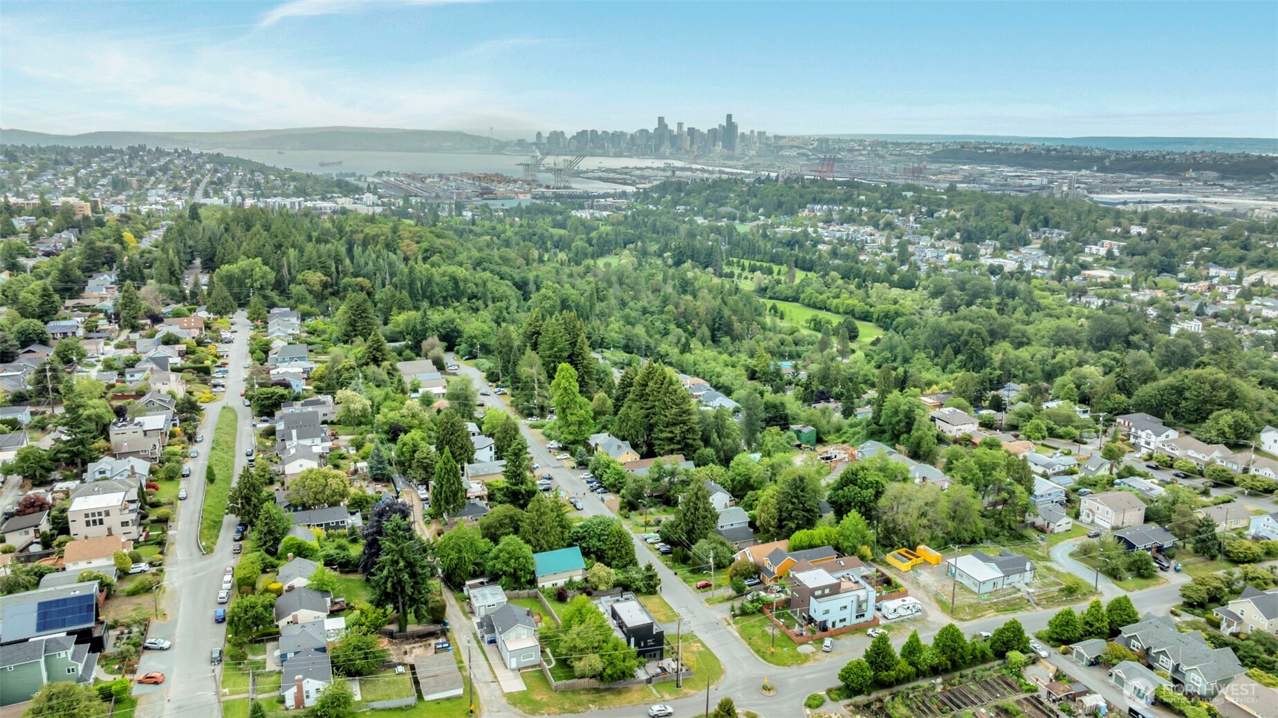 5630 32nd Avenue Southwest Seattle, WA 98126 - Photo 14 of 21 an aerial view of residential houses with outdoor space and trees