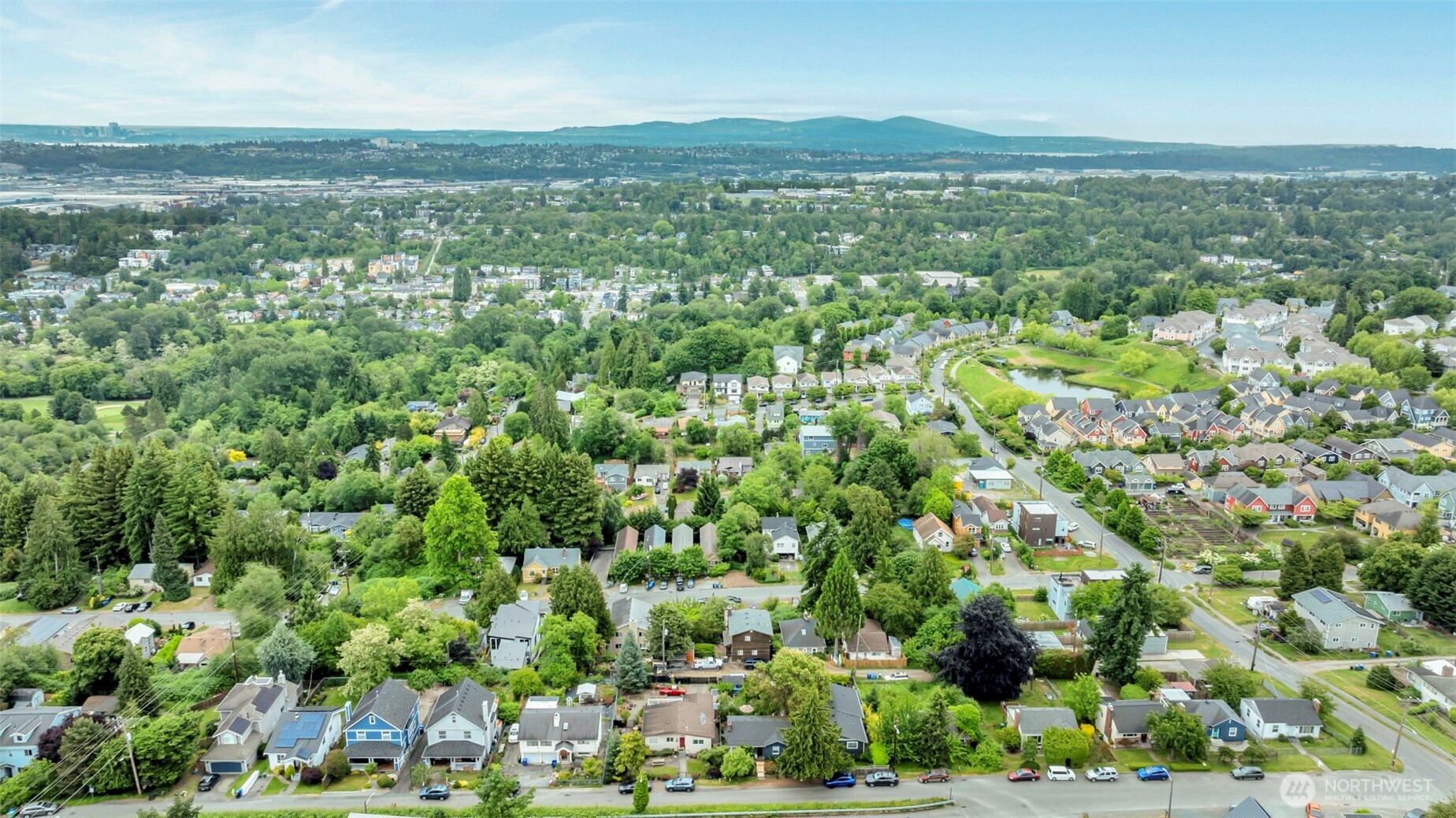 5630 32nd Avenue Southwest Seattle, WA 98126 - Photo 17 of 21 a view of a city with lush green forest