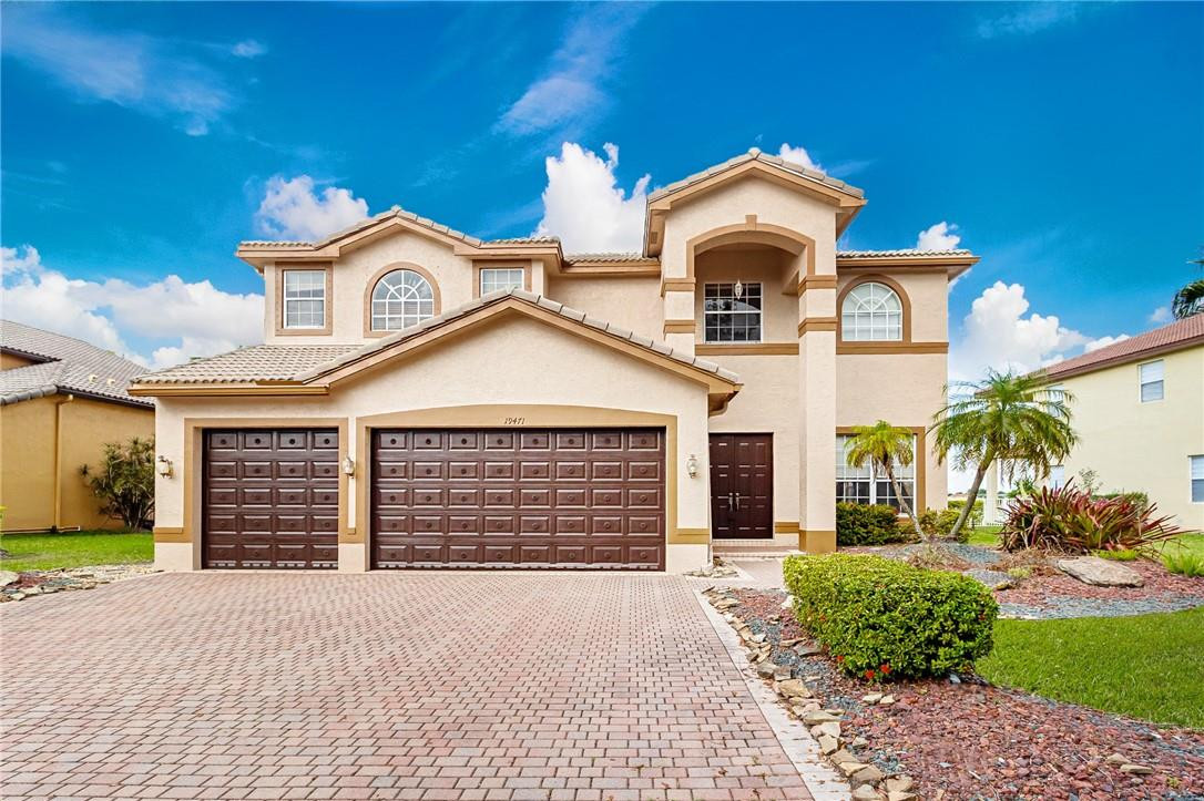 19471 Southwest 39th Street Miramar, FL 33029 - Photo 1 of 50 a front view of a house with a yard