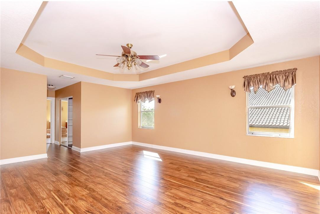 19471 Southwest 39th Street Miramar, FL 33029 - Photo 15 of 50 a view of an empty room with a window and wooden floor