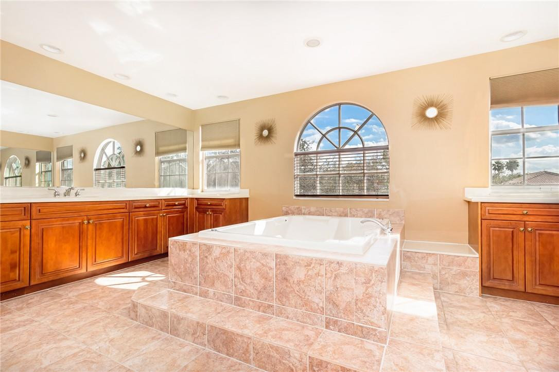 19471 Southwest 39th Street Miramar, FL 33029 - Photo 18 of 50 a large white tub sitting in a bathroom next to a window