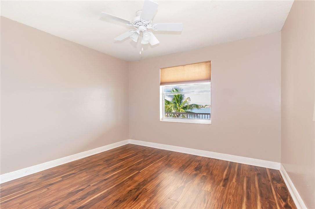 19471 Southwest 39th Street Miramar, FL 33029 - Photo 20 of 50 an empty room with wooden floor and windows