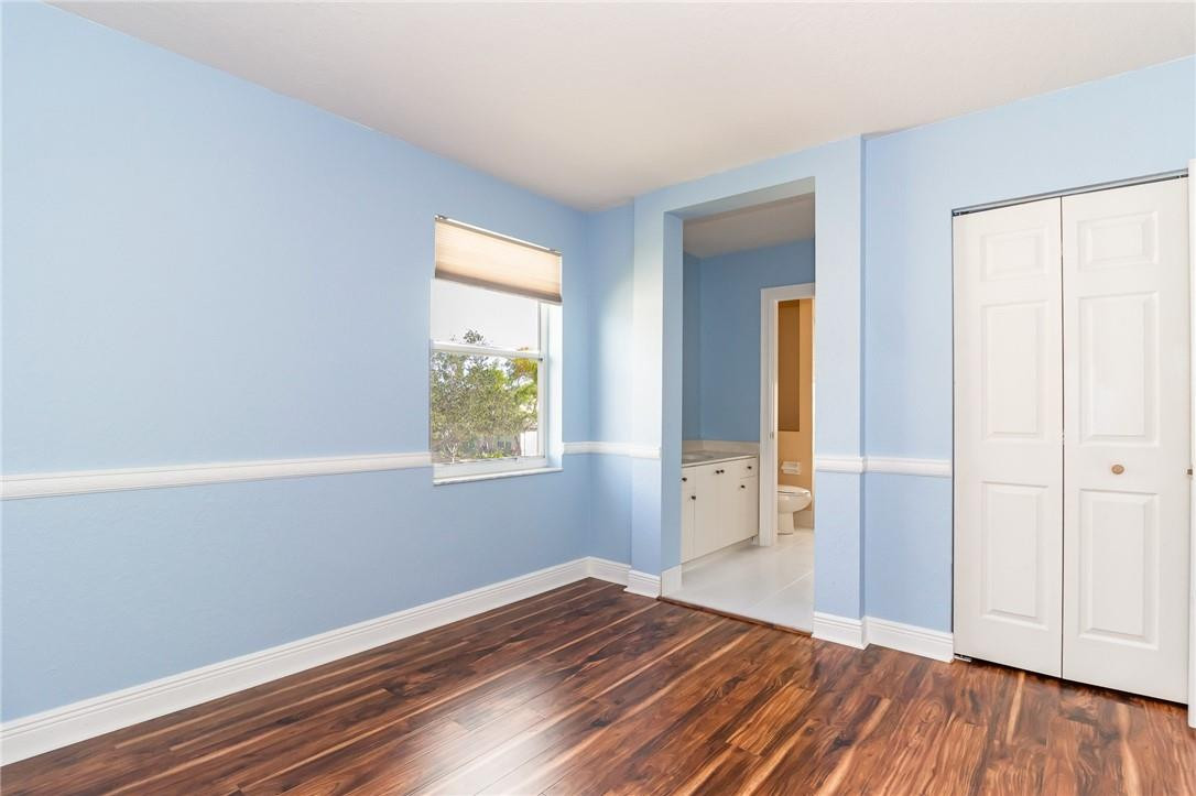 19471 Southwest 39th Street Miramar, FL 33029 - Photo 23 of 50 wooden floor in an empty room with a window