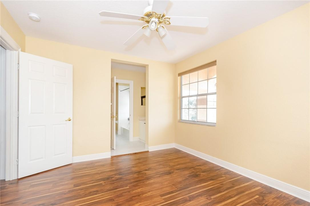 19471 Southwest 39th Street Miramar, FL 33029 - Photo 27 of 50 a view of an empty room with window and wooden floor