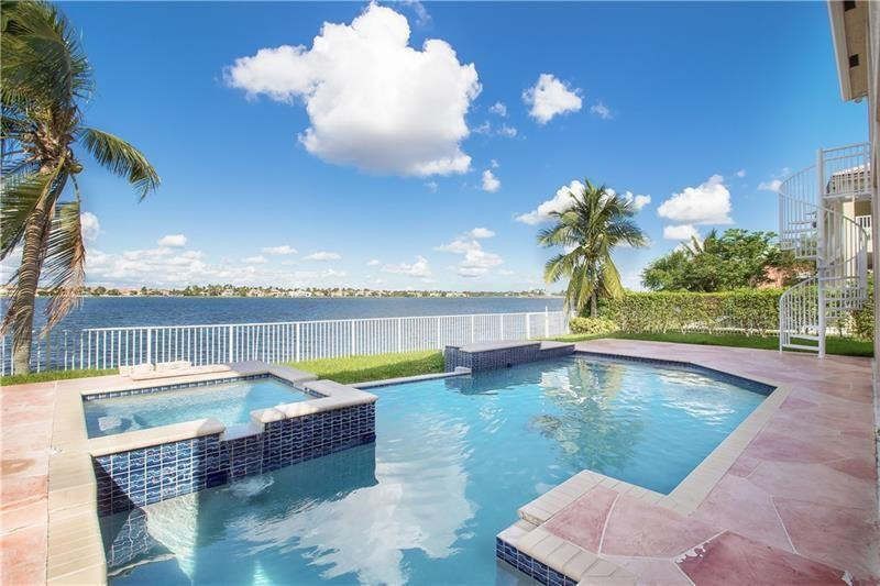 19471 Southwest 39th Street Miramar, FL 33029 - Photo 3 of 50 a view of a swimming pool with a lounge chairs
