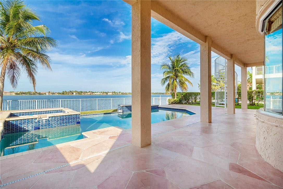 19471 Southwest 39th Street Miramar, FL 33029 - Photo 4 of 50 a view of a swimming pool with a patio and a garden