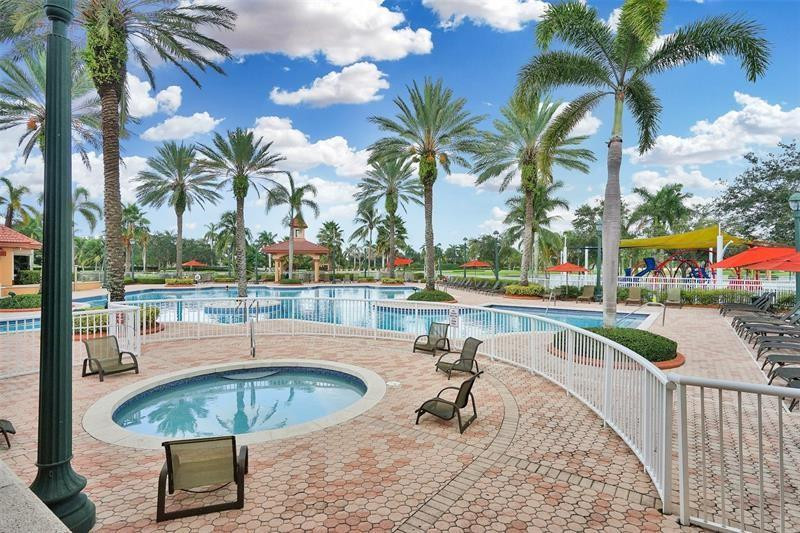 19471 Southwest 39th Street Miramar, FL 33029 - Photo 42 of 50 a view of a swimming pool with a table and chairs