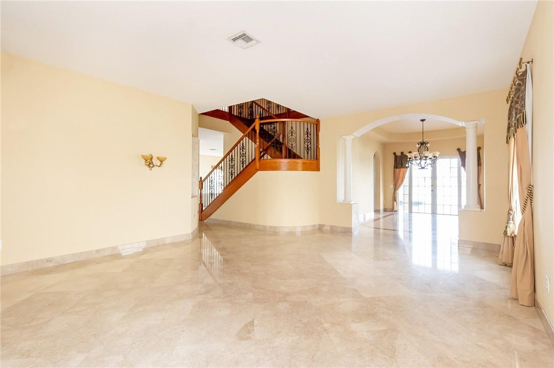 19471 Southwest 39th Street Miramar, FL 33029 - Photo 9 of 50 a view of a livingroom with wooden floor and stairs