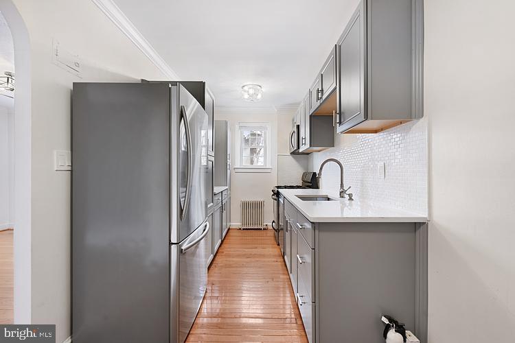 3925 Davis Place Northwest, Unit 206 Washington, DC 20007 - Photo 11 of 26 a kitchen with sink refrigerator and stove