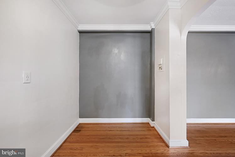 3925 Davis Place Northwest, Unit 206 Washington, DC 20007 - Photo 8 of 26 a view of an empty room with wooden floor