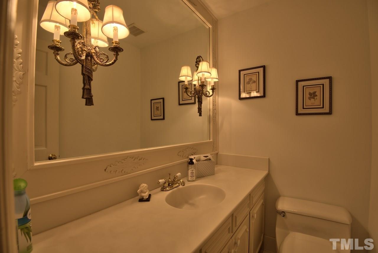 3916 St Marks Road Durham, NC 27707 - Photo 11 of 25 Main floor half bath between den and kitchen
