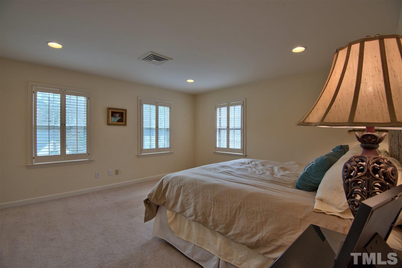 3916 St Marks Road Durham, NC 27707 - Photo 12 of 25 Plantation blinds on the many windows