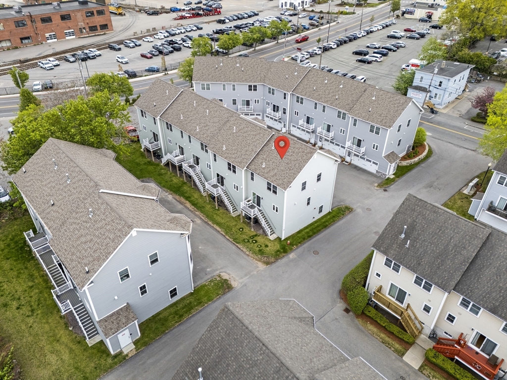 50 Des Moines Road, Unit H1 Quincy, MA 02169 - Photo 34 of 40 an aerial view of a house with outdoor space