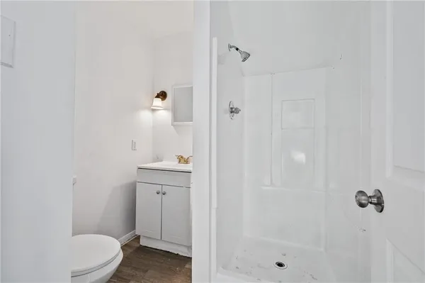 a kitchen with granite countertop a sink and cabinets