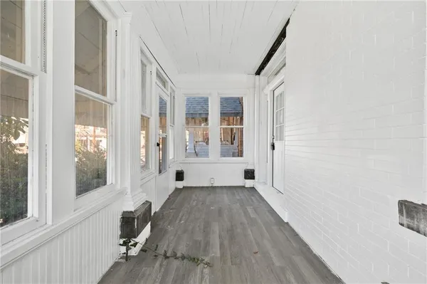 a view of entryway with wooden floor