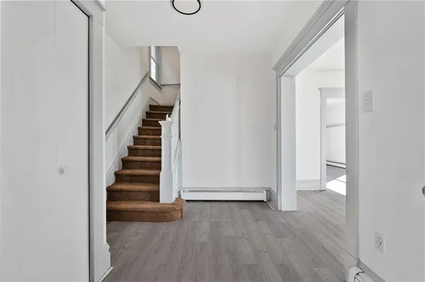 a view of entryway with wooden floor