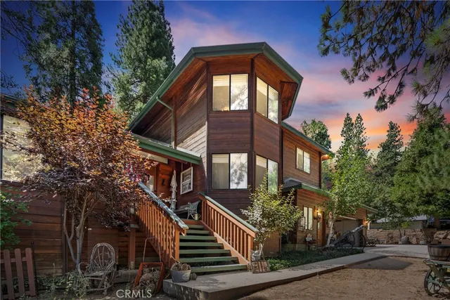 a view of a house with brick walls and a small yard