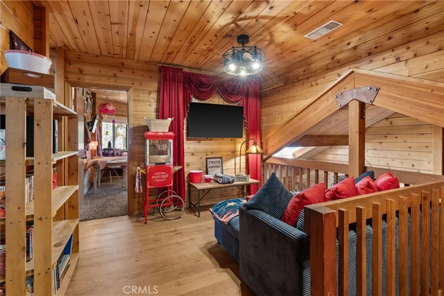 a bedroom with furniture and large windows