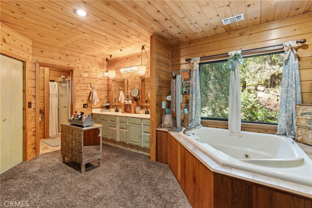 116 Pine Ridge Road Crestline, CA 92325 - Photo 19 of 35 a kitchen with a sink and large windows