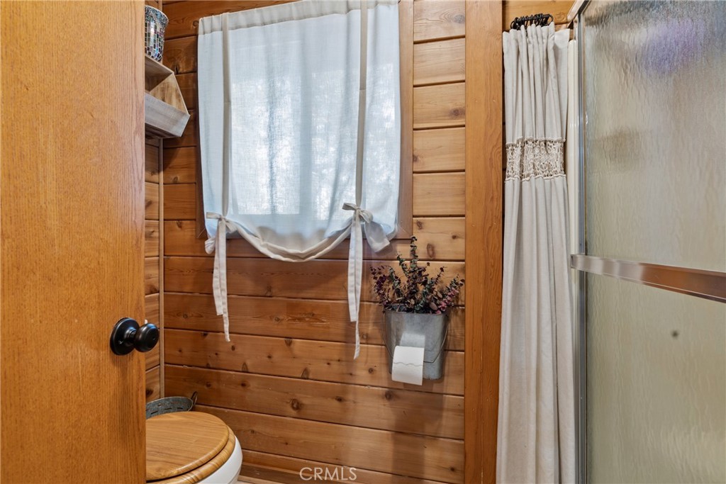 116 Pine Ridge Road Crestline, CA 92325 - Photo 21 of 35 a bathroom with a toilet and shower