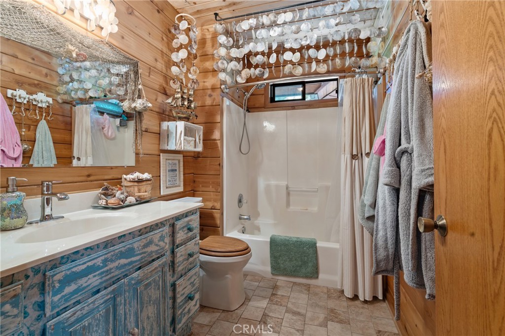 116 Pine Ridge Road Crestline, CA 92325 - Photo 24 of 35 a bathroom with a sink and a mirror