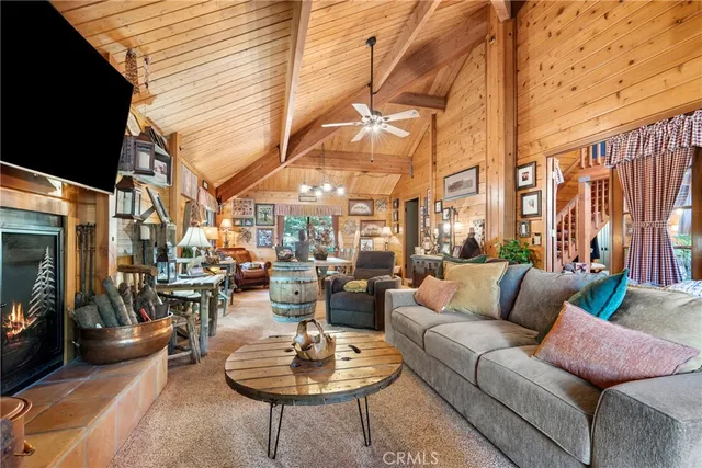a outdoor space with patio the couches and a fireplace