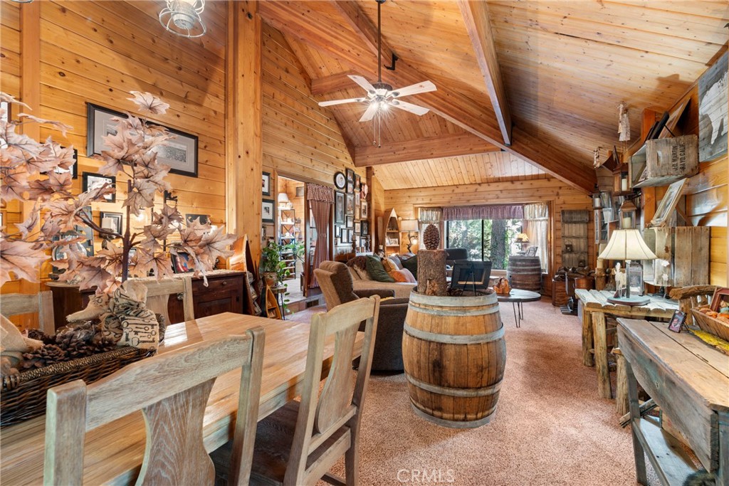 116 Pine Ridge Road Crestline, CA 92325 - Photo 6 of 35 a view of a patio with dining table and chairs