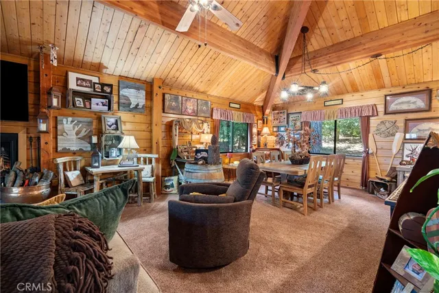 a view of a patio with couches table and chairs and potted plants