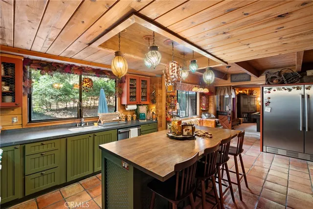 a dining table with chairs and window