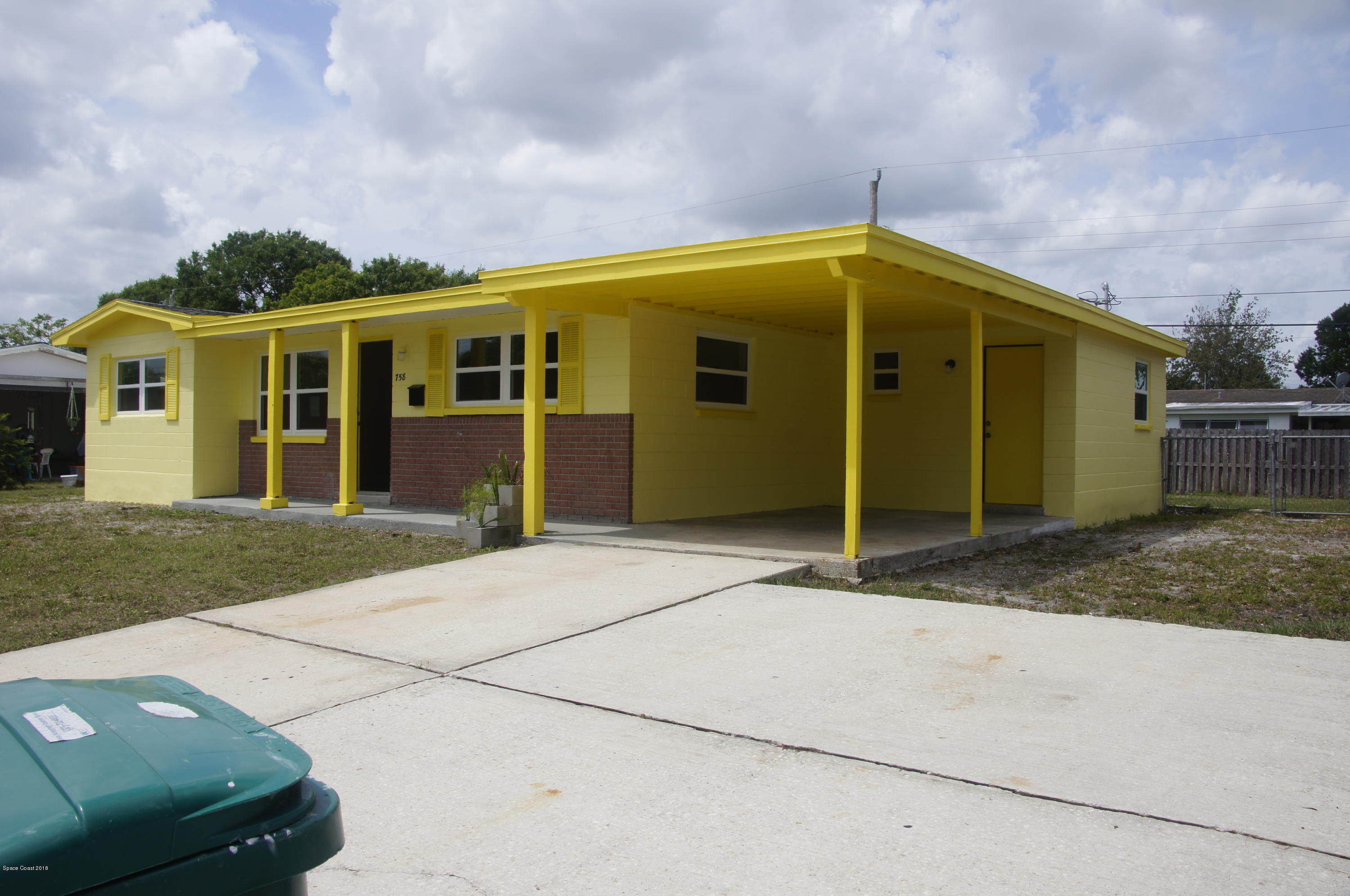 758 Croton Road Melbourne, FL 32935 - Photo 32 of 36 758 Croton Exterior Side Carport_DSC1449