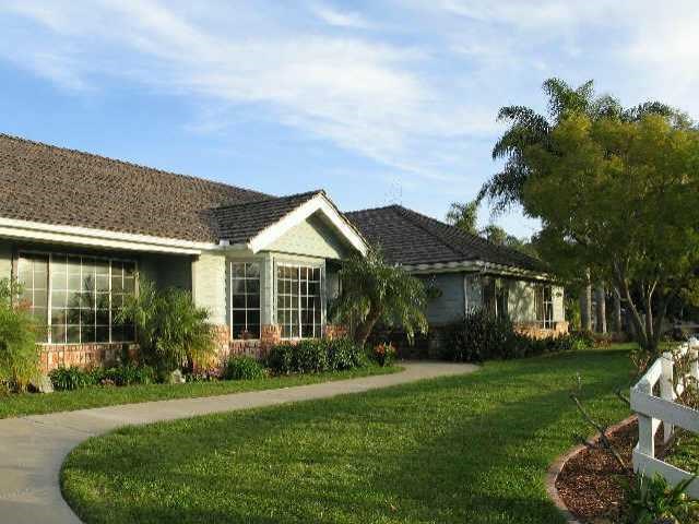4876 Sleeping Indian Road Fallbrook, CA 92028 - Photo 1 of 1 a front view of a house with garden