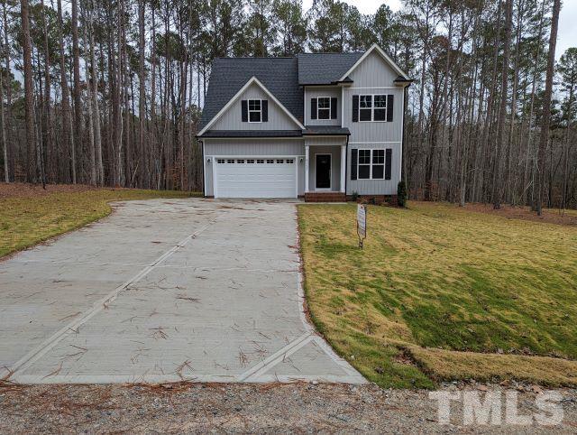 6237 Reagan Lane Wake Forest, NC 27587 - Photo 1 of 22 a front view of a house with a yard