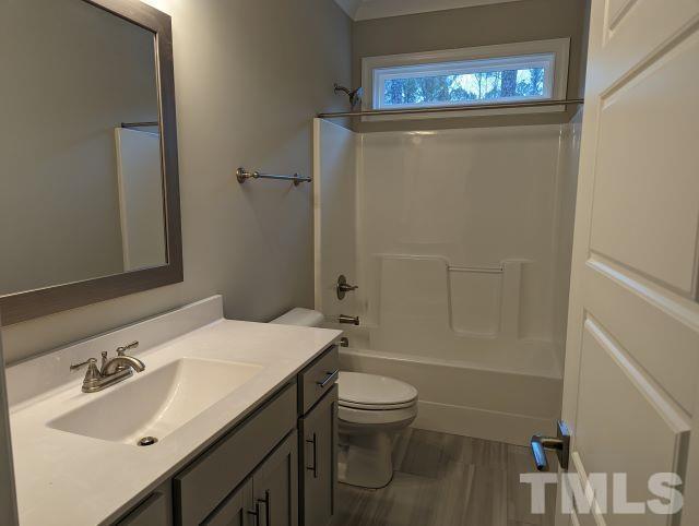 6237 Reagan Lane Wake Forest, NC 27587 - Photo 12 of 22 a bathroom with a sink toilet and shower